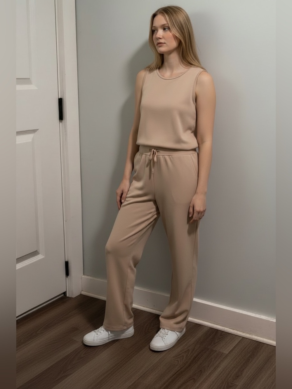 Susan Mathew’s Sleeveless Cream Jumpsuit with Drawstring Waist